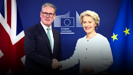 Keir Starmer shakes hands with Ursula von der Leyen in front of UK and EU flags at the European Commission headquarters.