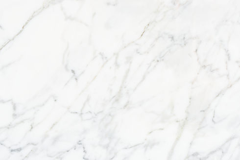 close-up-white-marble-textured-wall.jpg