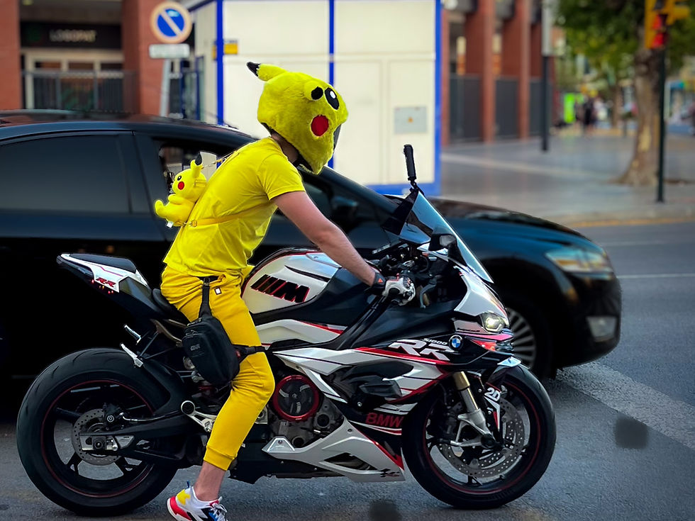 Man on BMW motorcycle with Pikachu helmet and Pikachu backpack