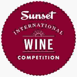 The Sunset International Wine Competition Logo = Burgundy circle with white text that reads, "Sunset International Wine Competition"