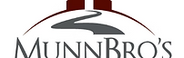 A maroon barn with a winding gray driveway leading to the words 'Munn Bro's Hood Canal Properties' in large lettering.