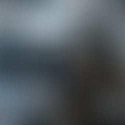 A gym with various equipment, including treadmills and weights. Bright lighting through windows; text "20 YEARS" seen on glass.