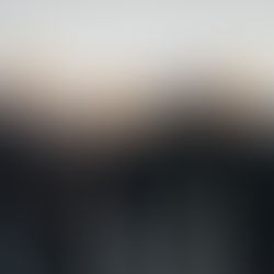 Four smiling men in black jackets and yellow beanies flex muscles under the bold text "ENERGY" on a gray wall.