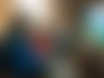 Children gathered around a TV playing video games