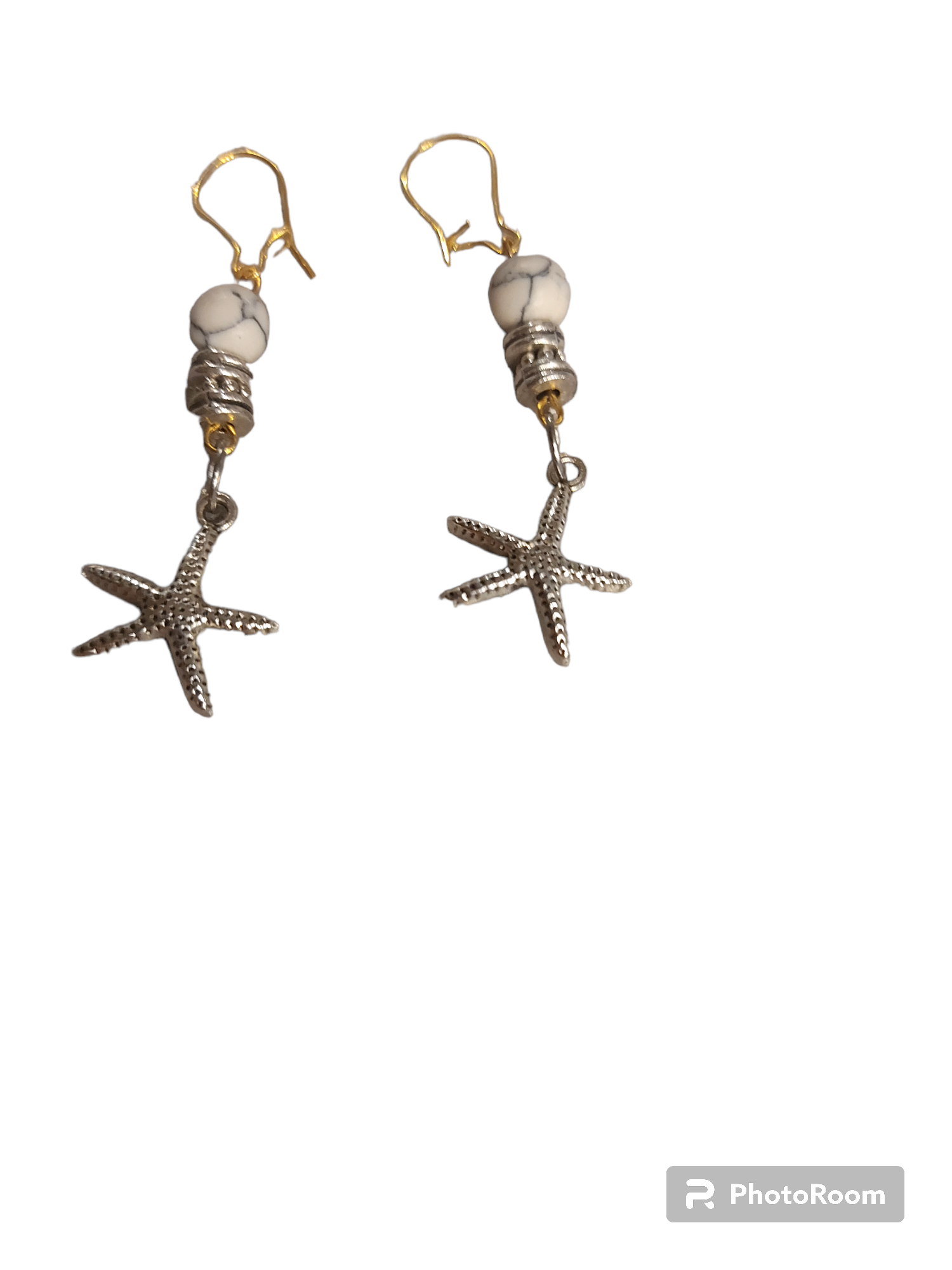 Boucle d'oreille steinless argent  étoile et argent