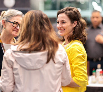 Guests networking and talking at a German Week Melbourne reception