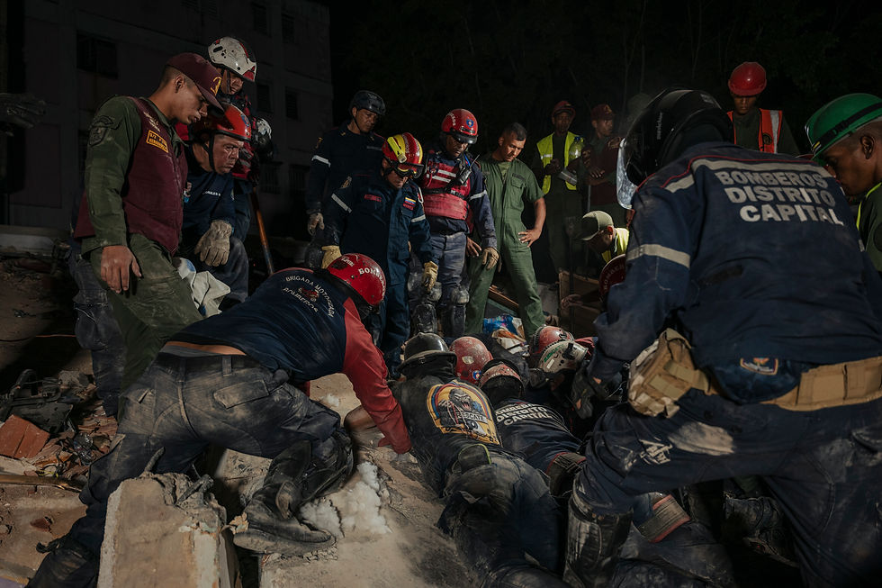 First responders attempt to remove bodies trapped in the rubble of a residential building that collapsed during an earthquake in Pinto Salinas, Venezuela, on Wednesday, June 24, 2026. Rescue crews intensified their search for survivors on Thursday as Venezuelans began to grapple with the scale of the devastation caused by the worst earthquakes to hit the country in nearly six decades. (Adriana Loureiro Fernandez/The New York Times)