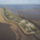 An aerial view of the Isle de Jean Charles, La., in an area of fragmented land once spanning thousands of acres that has been reduced to roughly just 320 acres by coastal erosion due to rising gulf waters, April 14, 2026. The residents of Isle de Jean Charles found safety after moving to higher ground, but some feel their experience has been more of a cautionary tale than a model for climate migration. (Wayan Barre/The New York Times)