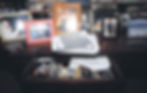 A credenza covered in photographs in a home of Jeffrey Epstein in an undated photo released by the U.S. Department of Justice on Friday, Dec. 19, 2025. More than a dozen photos — including one featuring President Donald Trump — were removed without explanation from the large collection of files connected to the investigations of Epstein that the Justice Department released on Friday.(U.S. Dept. of Justice via The New York Times)
