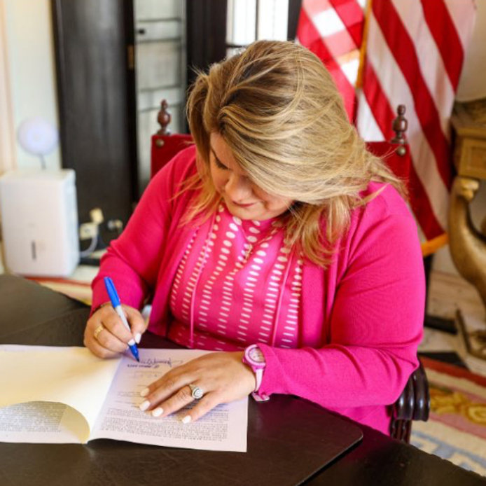 Governor signs laws on cooperatives and parole.