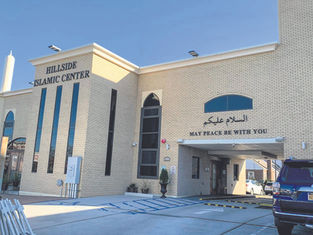 Security guard opens fire after truck rams Michigan synagogue.