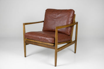 Brown leather armchair with wooden frame