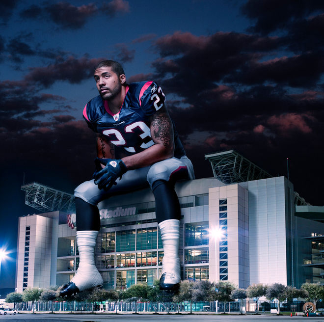 Arian Foster of Houston Texans sitting on stadium composite