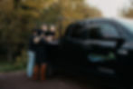 Two adults with two kids wearing black on Hydro Weed Plus Tundra pickup truck.