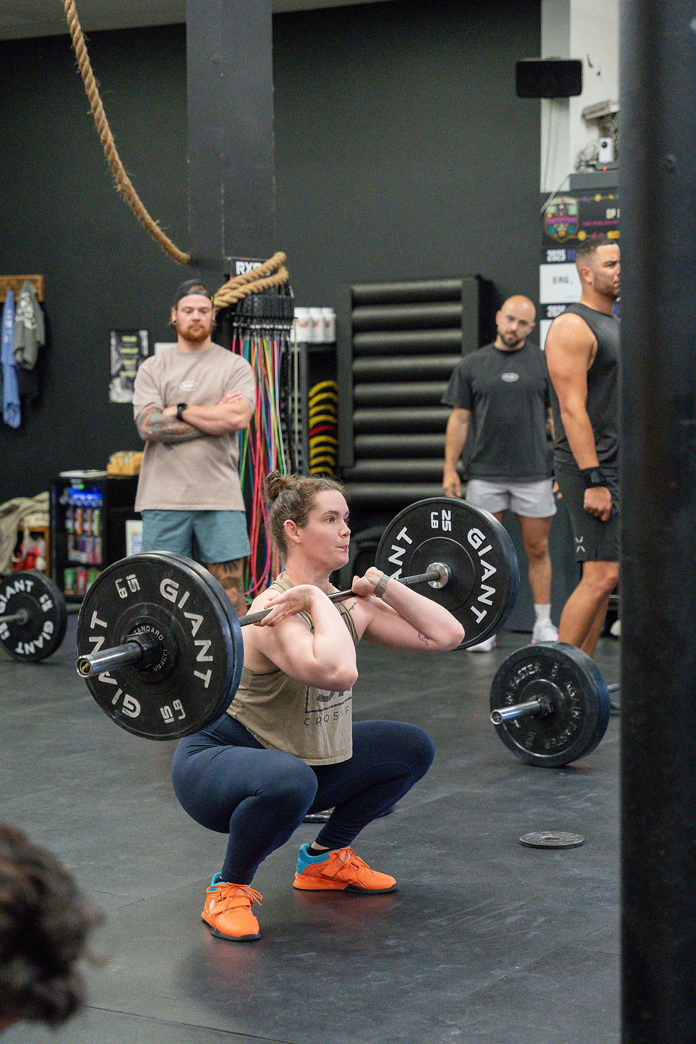 athlete front squatting at push athletics