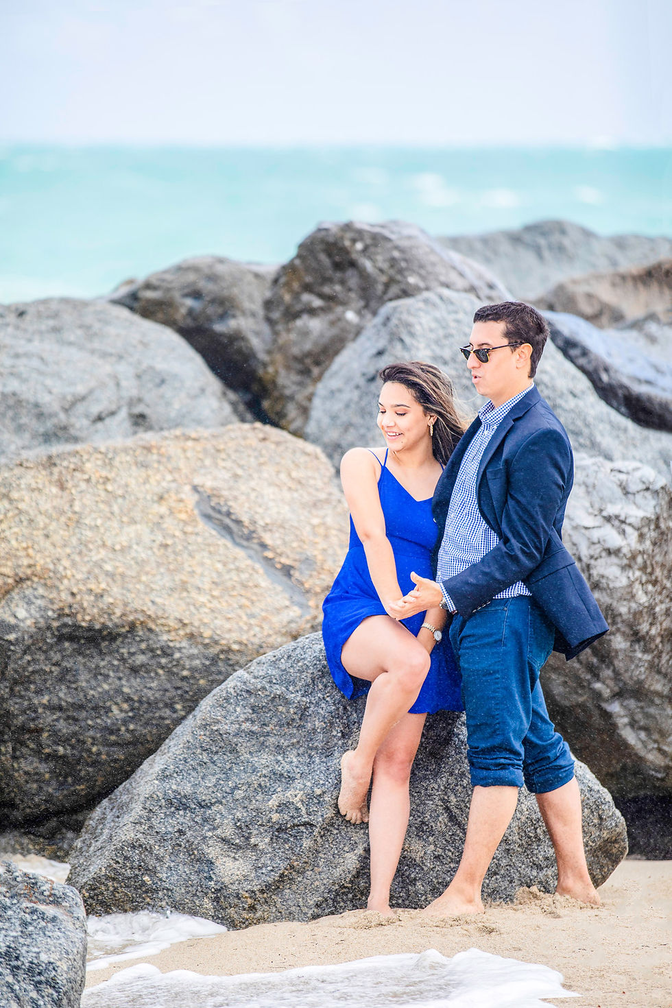 Newly engaged couple on beach
