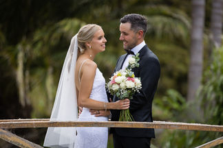 Bride and groom on bridge