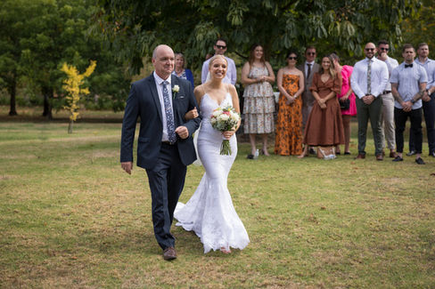 Bride and dad walking down the aisle