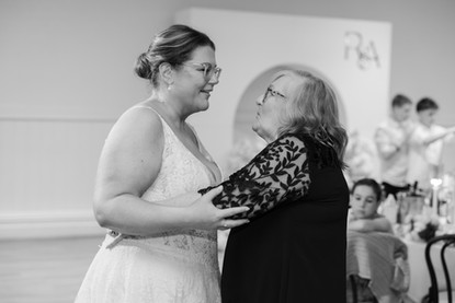 Bride and mother surrounded by family and friends at Witchmount Estate