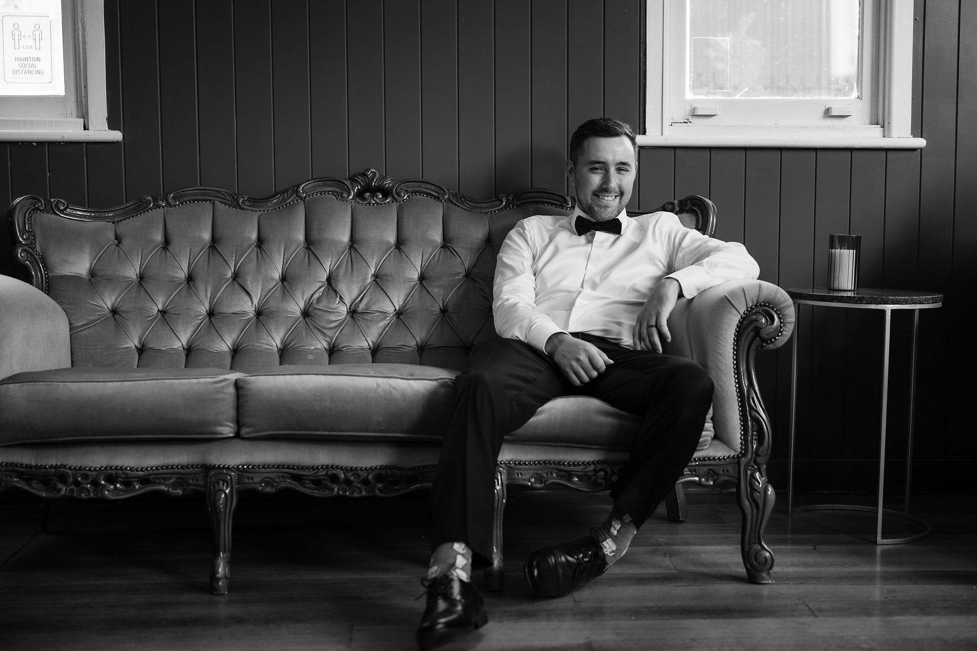 Groom sitting on couch