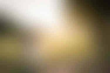 bride and groom on golf course at sunset