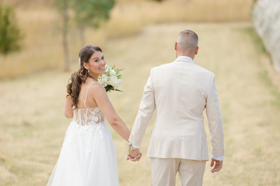 Bride and groom walking hand in hand at DV Cider Darraweit Guim wedding location