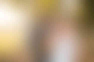 bride and groom on golf course at sunset