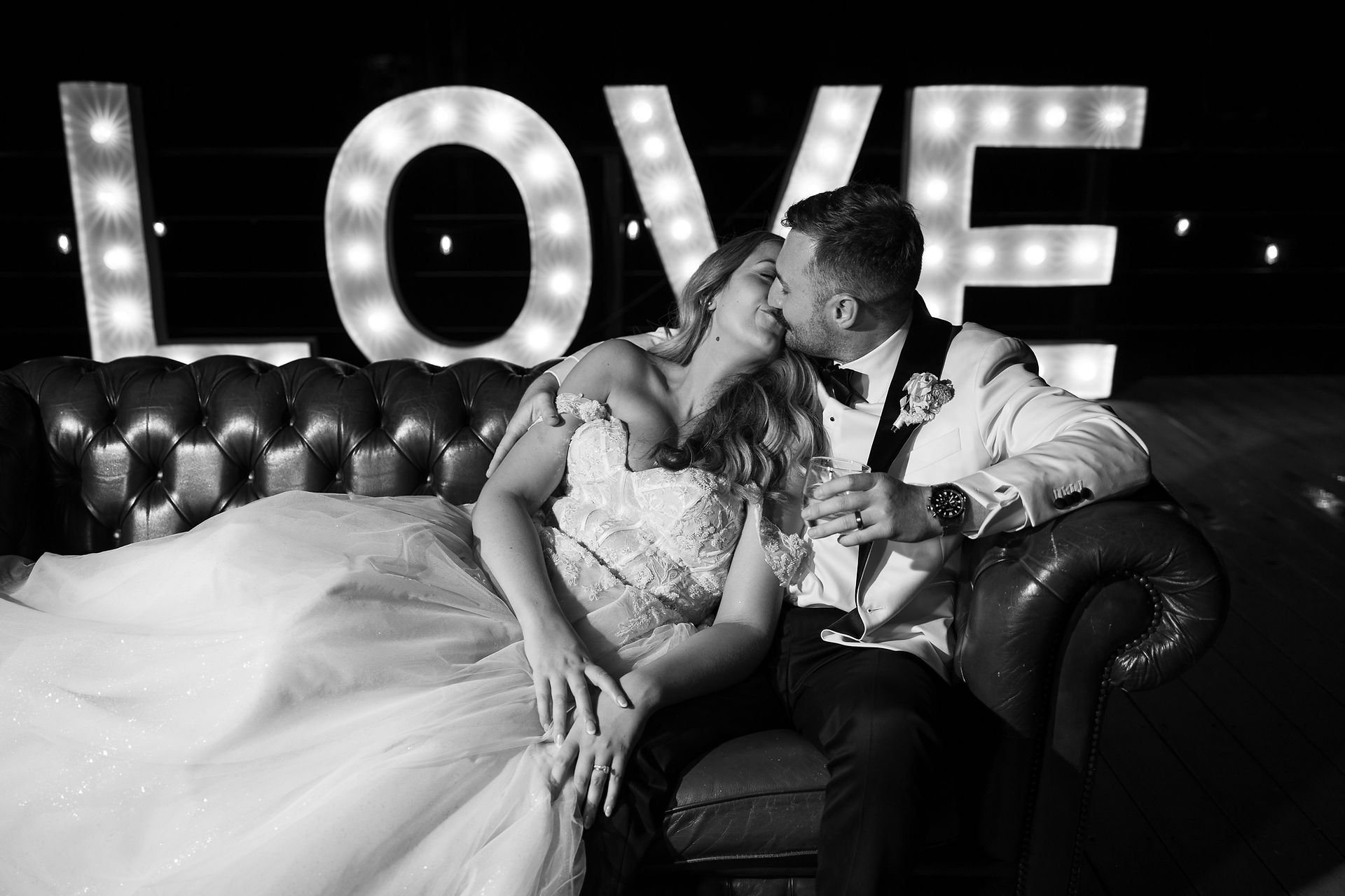 Newlyweds sharing a quiet moment together at the end of their wedding day.