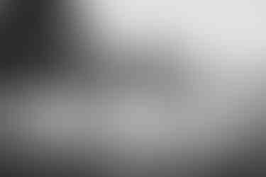 bride and groom on golf course at sunset