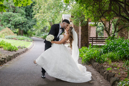 Bride and groom close embrace Footscray Botanical Gardens Melbourne