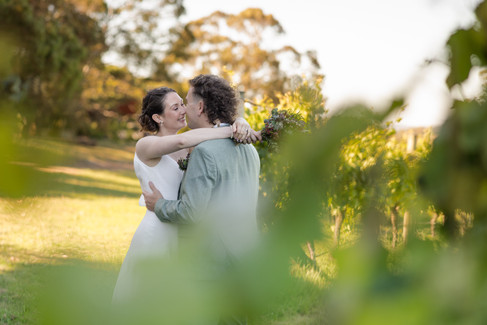 Bride and groom sharing a quiet moment in the Mount Monument Winery vineyards