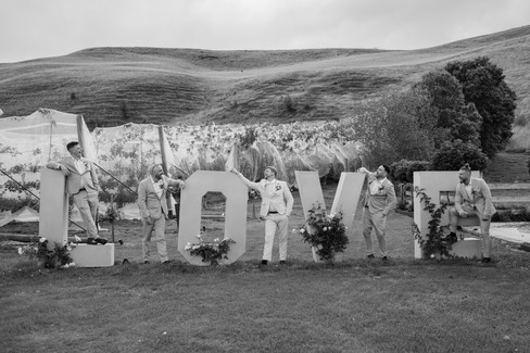 Groom posing with the Love sign at DV Cider