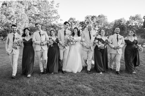 Bridal party portrait with dramatic sunset lighting in Macedon Ranges