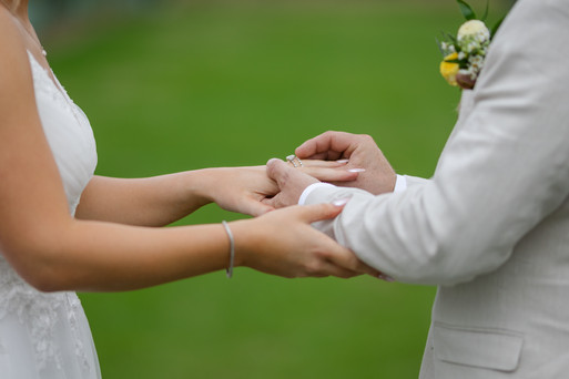 Bride and groom exchanging rings during rustic Yarra Valley wedding ceremony at DV Cider