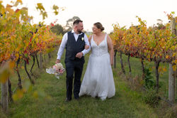 Melbourne wedding couple walking through golden light at Witchmount Estate winery
