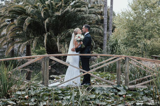 Bride and groom on bridge
