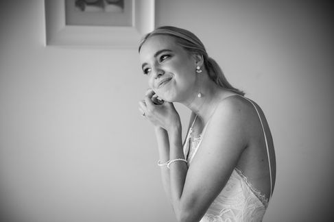 bride putting on earings