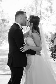 First kiss as husband and wife during the ceremony at Potters Receptions Melbourne