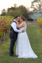 Romantic portrait with soft golden light filtering through vines