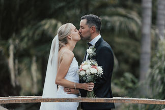Bride and groom on bridge