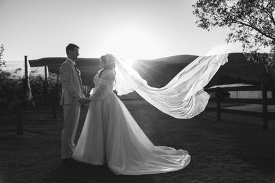 Elegant bride and groom portrait surrounded by rolling hills at DV Cider