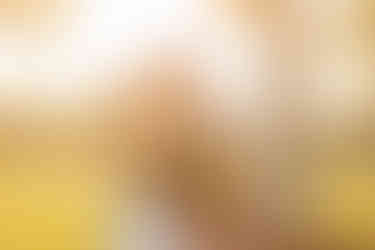 bride and groom on golf course at sunset