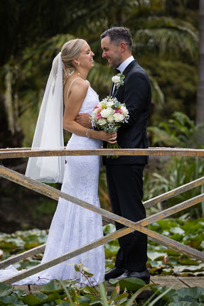Bride and groom on bridge