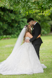 Couple kissing under trees Footscray Botanical Gardens Melbourne wedding photographer