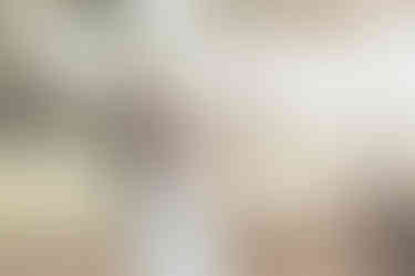 bride and groom on golf course at sunset