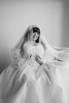 Bride smiling naturally during bridal portraits before wedding reception