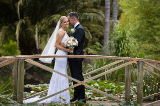 Bride and groom on bridge