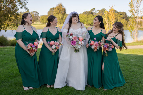 Bride laughing naturally during relaxed wedding morning with friends