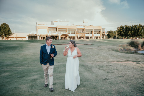 bride and groom at river view golf course