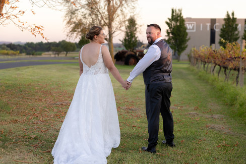 Groom admiring bride during golden hour wedding portraits